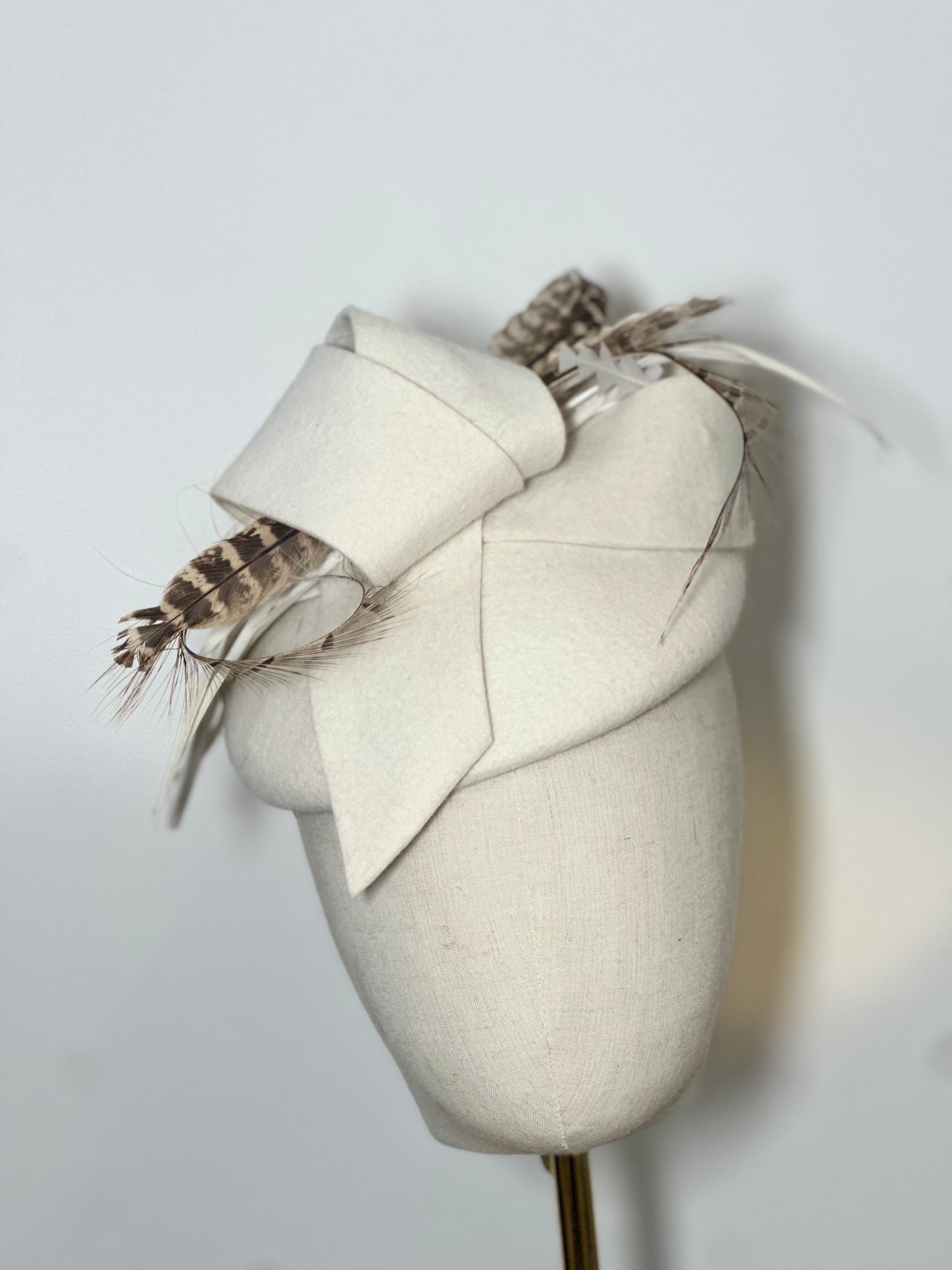 Cream wool heady with pheasant feather detail