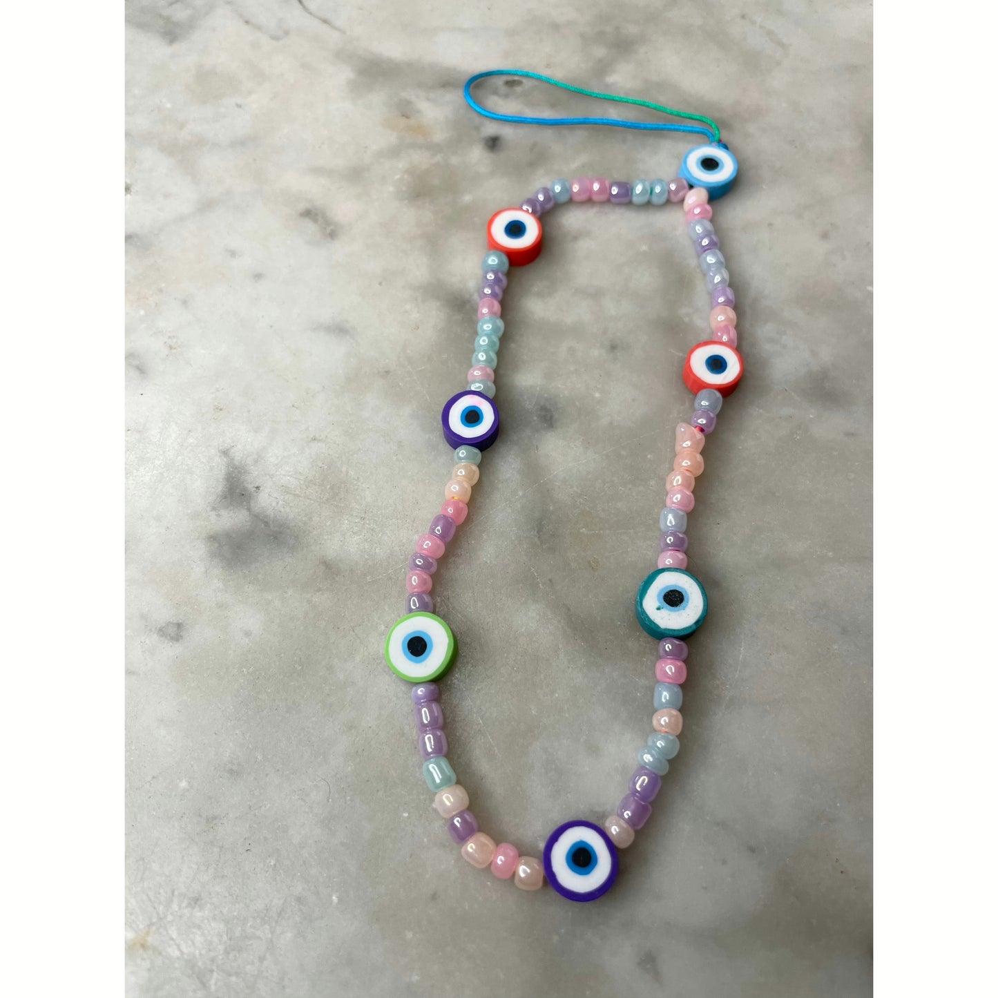 Pastel evil eye phone charm