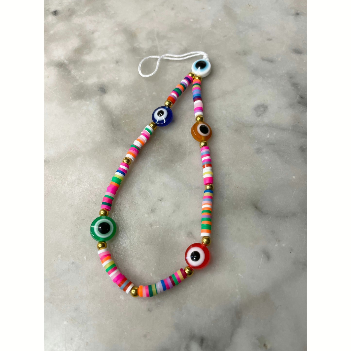 Multi coloured evil eye phone charm